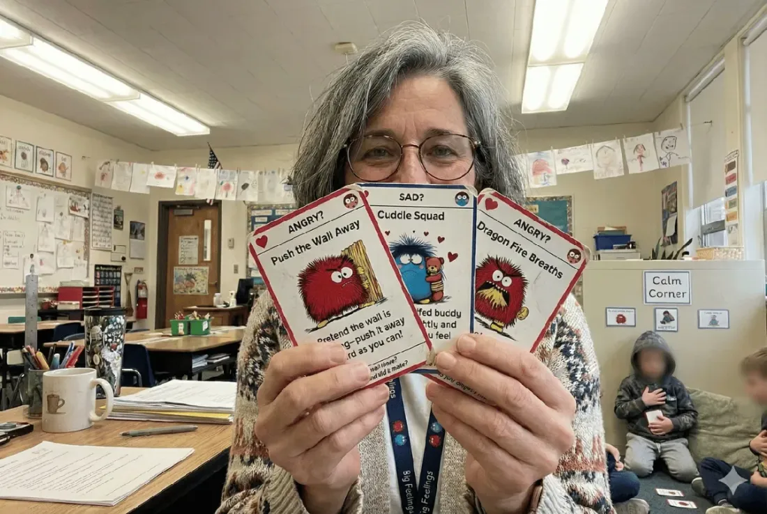 Happy students using cards