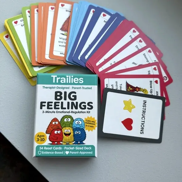 The Big Feelings Deck box with all 54 cards fanned in rainbow order