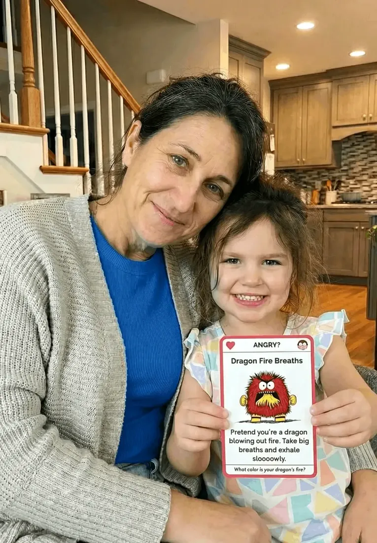 Parent and child reading from a Trailies card