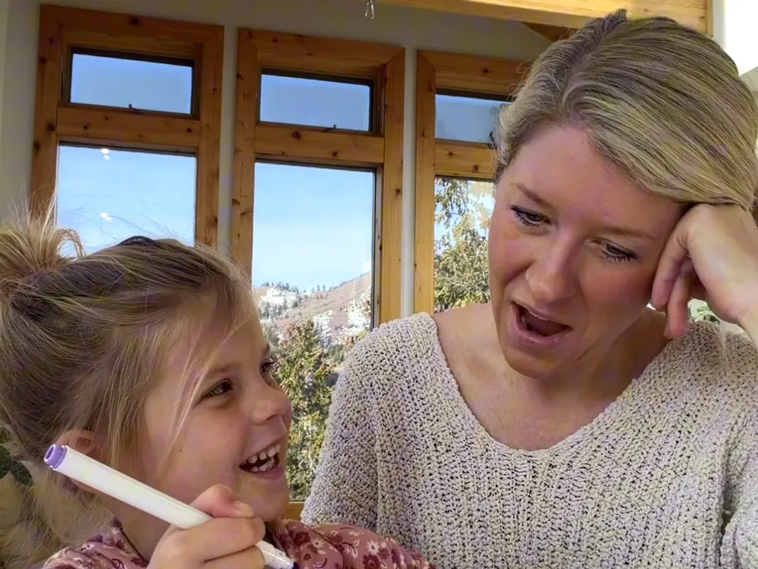 A mom and her giggling child mid Talk